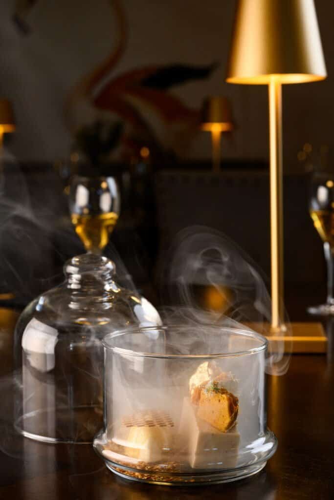 Delicious gourmet dish with modern plating at Palm House Boutique Hotel and Spa, showcasing an elegant dining experience in a luxurious setting in South Africa.