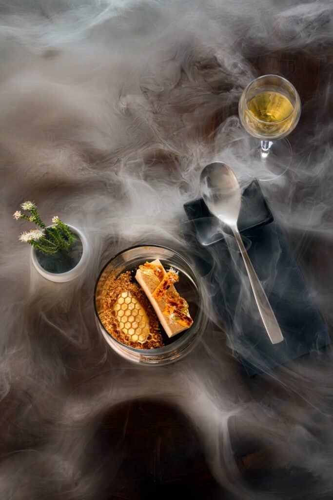 Elegant dessert and wine presentation at Palm House Boutique Hotel and Spa, showcasing luxurious dining experience in a sophisticated setting in South Africa.