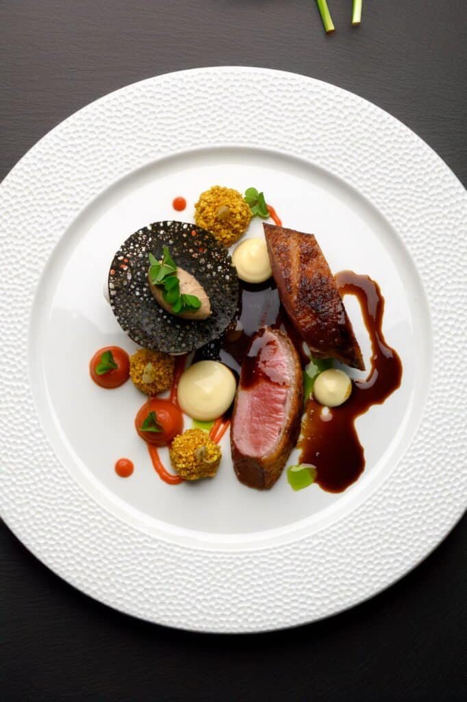 Luxurious gourmet dish served at Palm House Boutique Hotel and Spa, showcasing fine dining, elegant presentation, and premium local ingredients in a sophisticated hotel setting.