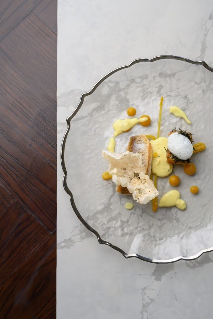 Elegant culinary dish served on a decorative glass plate at Palm House Boutique Hotel and Spa in South Africa, showcasing gourmet cuisine, fine dining, and sophisticated presentation.