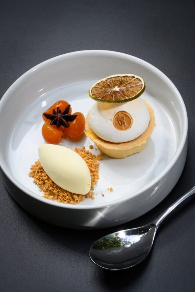 Layers of a luxurious dessert served at Palm House Boutique Hotel and Spa, featuring artfully presented gourmet sweets perfect for a refined dining experience.